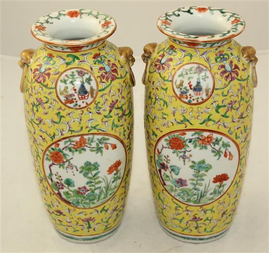 A pair of Chinese yellow ground famille rose vases, Jiaqing marks, early 20th century, 23cm